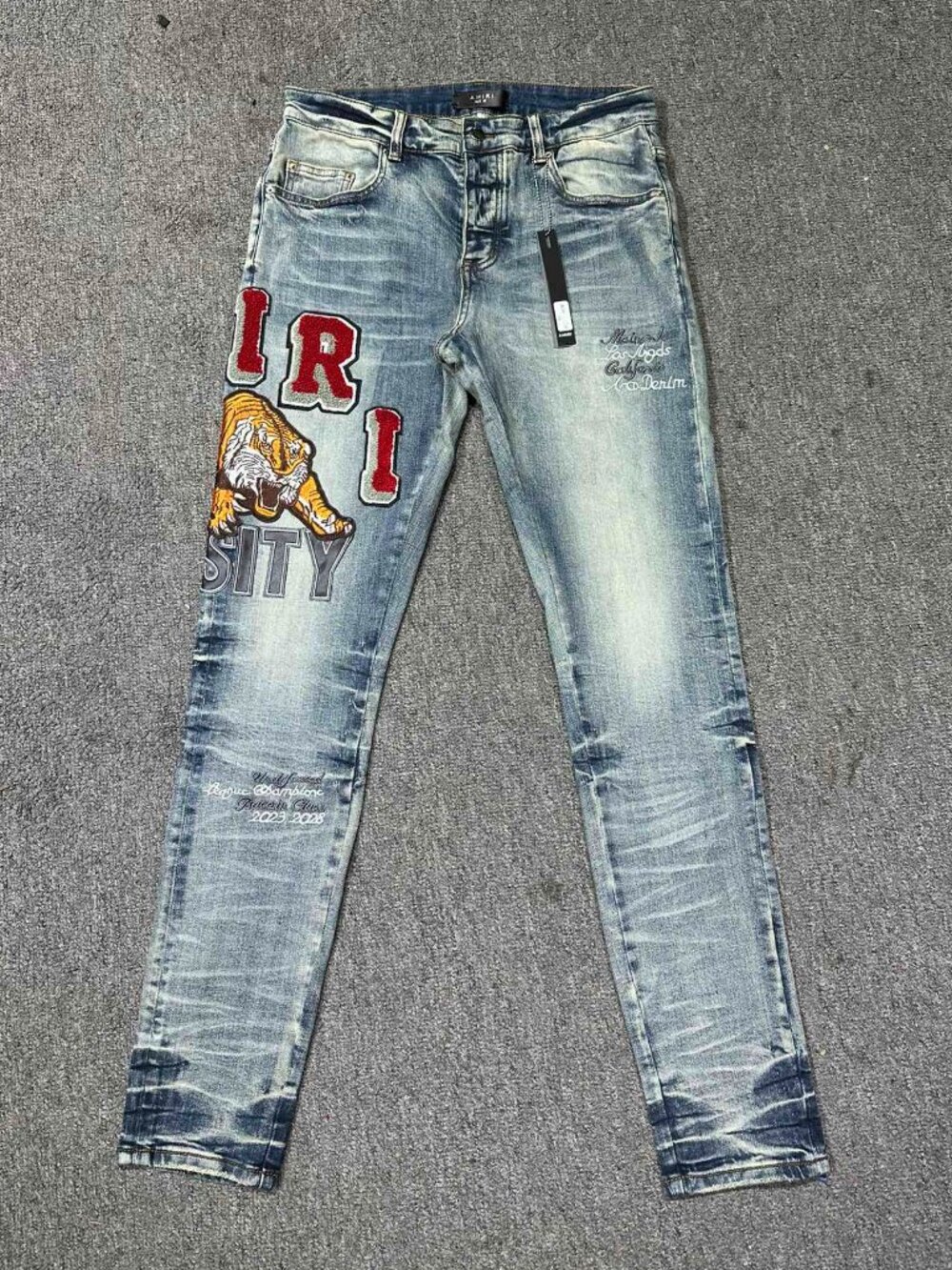 AMIRI Tiger Pattern Logo Straight Leg Jeans In Light Blue